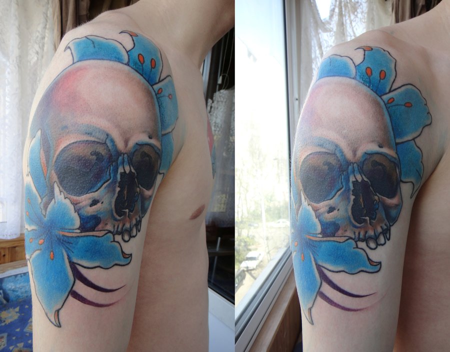 Skull and flowers tattoo